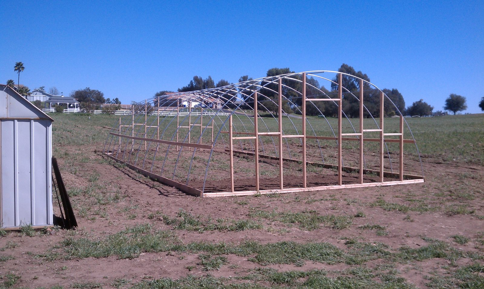 The hoop frame with timber end wall framing added at one end.